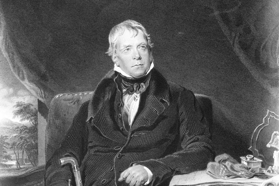 Sir Walter Scott as a middle aged man, holding a walking stick and sitting beside a writing desk